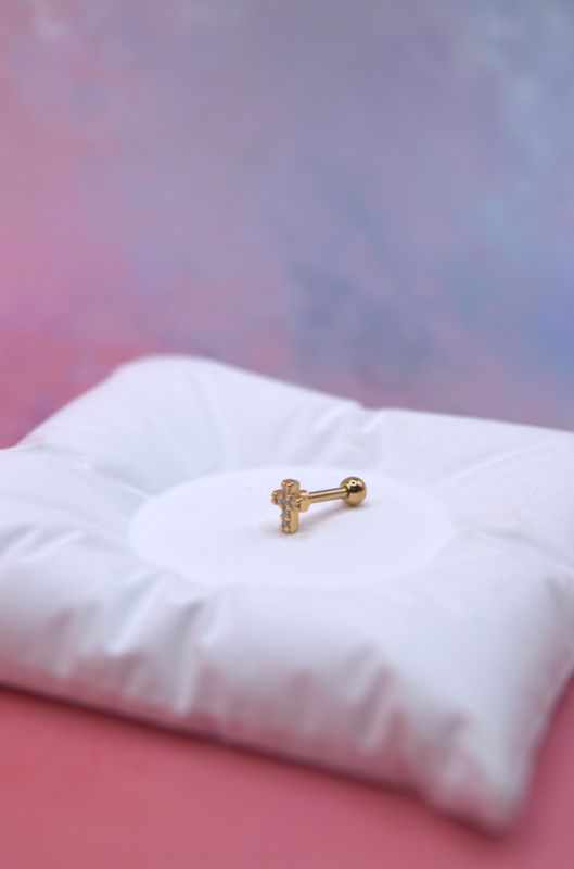 Golden Cross piercing